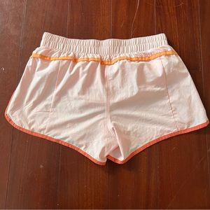 Gap Fit running shorts. Pink / peach. Size small.